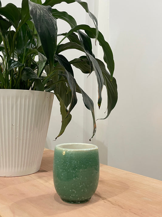 Judy / Green teacup with white dotted pattern